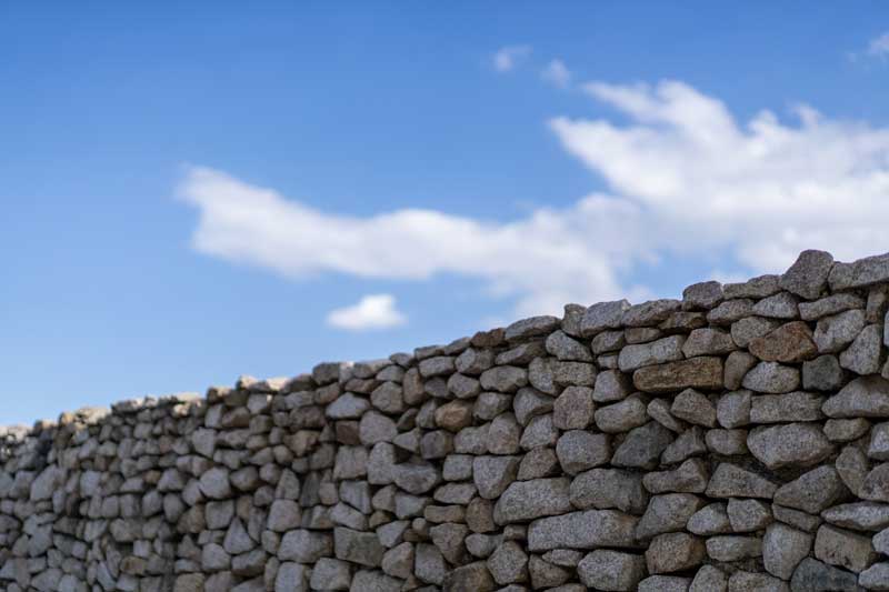 shutterstock_1701689065 stone property walls stone privacy walls